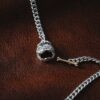 a silver chain with a skull on it